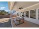 Enjoy this covered patio with an outdoor ceiling fan, a picnic table, and access to a level backyard at 2808 Blandwood Rd, Marietta, GA 30064