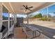 Enjoy this covered patio with an outdoor ceiling fan, a picnic table, and a fenced-in backyard at 2808 Blandwood Rd, Marietta, GA 30064
