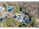 Aerial view features tennis courts, pool, well manicured grounds, and private setting at 3980 Saint Elisabeth Sq, Duluth, GA 30096