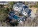 Gorgeous aerial view of a luxury home with a stunning pool and manicured backyard perfect for entertainment at 3980 Saint Elisabeth Sq, Duluth, GA 30096