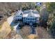 Aerial view of a large white home with mature trees and landscaping surrounding a circular driveway at 3980 Saint Elisabeth Sq, Duluth, GA 30096