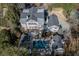 An aerial view captures the backyard pool, mature trees, and manicured lawn at 3980 Saint Elisabeth Sq, Duluth, GA 30096