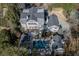 Backyard aerial view showcasing a beautiful pool, patio area, and lush landscaping at 3980 Saint Elisabeth Sq, Duluth, GA 30096