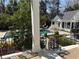 Charming home featuring wrought iron railings overlooking a sparkling pool and landscaped backyard at 3980 Saint Elisabeth Sq, Duluth, GA 30096
