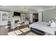 Spacious bedroom with a fireplace, built-in shelves, and an open layout at 3980 Saint Elisabeth Sq, Duluth, GA 30096