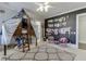 Fun bedroom features whimsical treehouse-style bed, creative wall decor, and playful furnishings at 3980 Saint Elisabeth Sq, Duluth, GA 30096