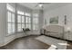 Bedroom with bay window and white shutters allowing ample natural light to fill the space at 3980 Saint Elisabeth Sq, Duluth, GA 30096