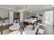 Elegant bedroom with hardwood floors, a sitting area, and an en-suite bathroom view at 3980 Saint Elisabeth Sq, Duluth, GA 30096