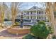 Stunning water feature in front of a two-story home with white pillars and black shutters at 3980 Saint Elisabeth Sq, Duluth, GA 30096