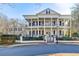 Elegant two-story home boasts striking architectural details, manicured landscaping, and a welcoming entrance at 3980 Saint Elisabeth Sq, Duluth, GA 30096