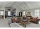 A sprawling game room offers a pool table, couches, wet bar, and natural lighting at 3980 Saint Elisabeth Sq, Duluth, GA 30096