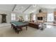 Spacious game room with pool table, lounge area, and custom built-ins at 3980 Saint Elisabeth Sq, Duluth, GA 30096