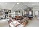 Expansive game room with a leather sofa, arcade games, wet bar, and decor at 3980 Saint Elisabeth Sq, Duluth, GA 30096