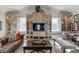 Comfortable game room with built-in cabinets, a television, pinball machine, and comfortable seating at 3980 Saint Elisabeth Sq, Duluth, GA 30096