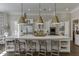 Bright kitchen with marble countertop island, pendant lighting, and stainless steel appliances at 3980 Saint Elisabeth Sq, Duluth, GA 30096