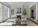 Bright living room featuring fireplace, bookshelves and large windows at 3980 Saint Elisabeth Sq, Duluth, GA 30096