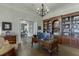 Charming home office featuring custom built-ins and elegant hardwood flooring at 3980 Saint Elisabeth Sq, Duluth, GA 30096