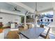 Charming outdoor living space featuring a covered patio with a full kitchen, fireplace, comfortable seating, and dining areas at 3980 Saint Elisabeth Sq, Duluth, GA 30096