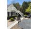 Charming patio area with outdoor seating, offering a lovely view of the surrounding landscaping and architecture at 3980 Saint Elisabeth Sq, Duluth, GA 30096
