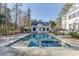 Exterior shot of a pool and pool house, enhanced by well-maintained landscaping for an inviting backyard setting at 3980 Saint Elisabeth Sq, Duluth, GA 30096