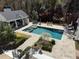 Stunning backyard oasis featuring a pool, spa, and outdoor kitchen perfect for entertaining and relaxing at 3980 Saint Elisabeth Sq, Duluth, GA 30096