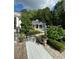 Inviting backyard pool with cabana and lush landscaping offers a private outdoor retreat at 3980 Saint Elisabeth Sq, Duluth, GA 30096