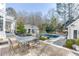 Outdoor living area with a pool, pool house, and patio furniture, perfect for entertaining and relaxation at 3980 Saint Elisabeth Sq, Duluth, GA 30096