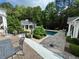 Backyard view showcases the pool, cabana, and landscaped patio with ample seating at 3980 Saint Elisabeth Sq, Duluth, GA 30096