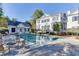 A stunning backyard showcases a swimming pool, pool house, and lush greenery, creating a serene outdoor escape at 3980 Saint Elisabeth Sq, Duluth, GA 30096