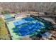 Aerial view features multiple well-maintained tennis courts, a gazebo, and lush landscaping at 3980 Saint Elisabeth Sq, Duluth, GA 30096