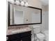Bathroom with a vanity with a granite countertop, large mirror and a toilet at 903 Bridge Se Ln, Smyrna, GA 30082