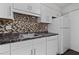 Charming kitchen featuring white cabinets and modern appliances at 903 Bridge Se Ln, Smyrna, GA 30082