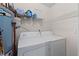 Laundry room with a water heater, washer and dryer, plus storage at 903 Bridge Se Ln, Smyrna, GA 30082
