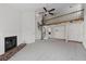 Spacious living room featuring fireplace, spiral staircase leading to a loft, and neutral carpet at 903 Bridge Se Ln, Smyrna, GA 30082