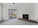 Cozy living room showcasing fireplace and balcony with sliding glass door at 903 Bridge Se Ln, Smyrna, GA 30082