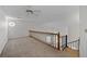 Spacious loft featuring neutral carpeting, natural light, and a view of the stairwell at 903 Bridge Se Ln, Smyrna, GA 30082
