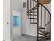 Spiral staircase leading to a room with a large window at 903 Bridge Se Ln, Smyrna, GA 30082