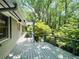 This home has a serene back deck overlooking lush greenery and mature trees at 1263 Briarcliff Ne Rd, Atlanta, GA 30306