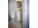 Cozy bathroom featuring a white toilet, vanity, mirror, and neutral colored tile flooring at 1263 Briarcliff Ne Rd, Atlanta, GA 30306