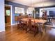 Elegant dining room featuring hardwood floors, modern lighting, and a mirrored wall enhancing the space at 1263 Briarcliff Ne Rd, Atlanta, GA 30306
