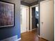 Spacious hallway featuring hardwood floors, multiple doors, and wall art at 1263 Briarcliff Ne Rd, Atlanta, GA 30306