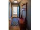 This hallway is accented by a decorative bench and rug at 1263 Briarcliff Ne Rd, Atlanta, GA 30306