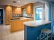 Kitchen features light wood cabinets, breakfast bar, tiled floors, and stainless steel stove at 1263 Briarcliff Ne Rd, Atlanta, GA 30306
