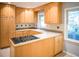 Kitchen features light wood cabinets, stainless steel appliances, and view to backyard at 1263 Briarcliff Ne Rd, Atlanta, GA 30306