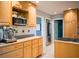 Kitchen features light wood cabinets, stainless steel appliances, and tiled backsplash at 1263 Briarcliff Ne Rd, Atlanta, GA 30306