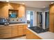 Kitchen features light wood cabinets, stainless steel appliances, and tiled backsplash at 1263 Briarcliff Ne Rd, Atlanta, GA 30306