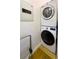 Efficient laundry area with stacked washer and dryer, plus a security box at 1263 Briarcliff Ne Rd, Atlanta, GA 30306