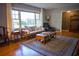Inviting living room featuring hardwood floors, a cozy seating area, and ample natural light creating a comfortable space at 1263 Briarcliff Ne Rd, Atlanta, GA 30306