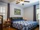 The main bedroom features hardwood floors, overhead fan, shutters, and picture window at 1263 Briarcliff Ne Rd, Atlanta, GA 30306