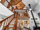 Bright living room featuring unique architecture, wooden staircase and fireplace at 1275 S Deshon Rd, Lithonia, GA 30058